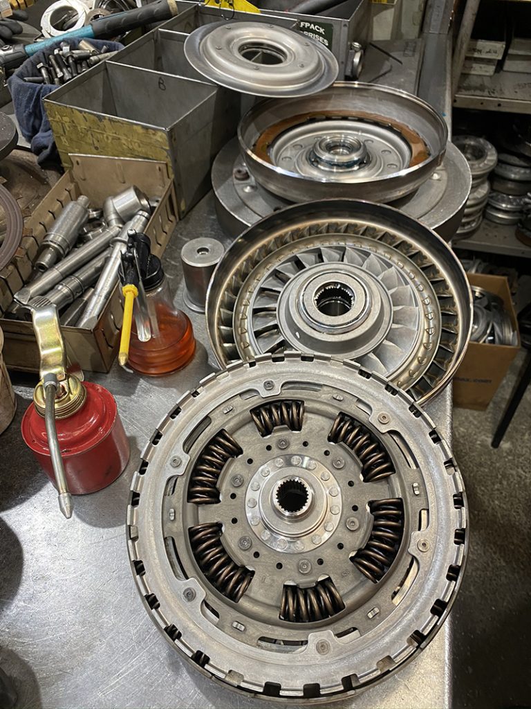Torque converter being inspected on the workshop bench